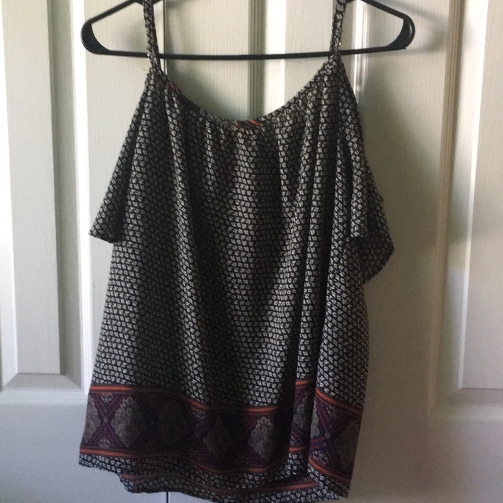 A faded muti-colored off the shoulder  blouse